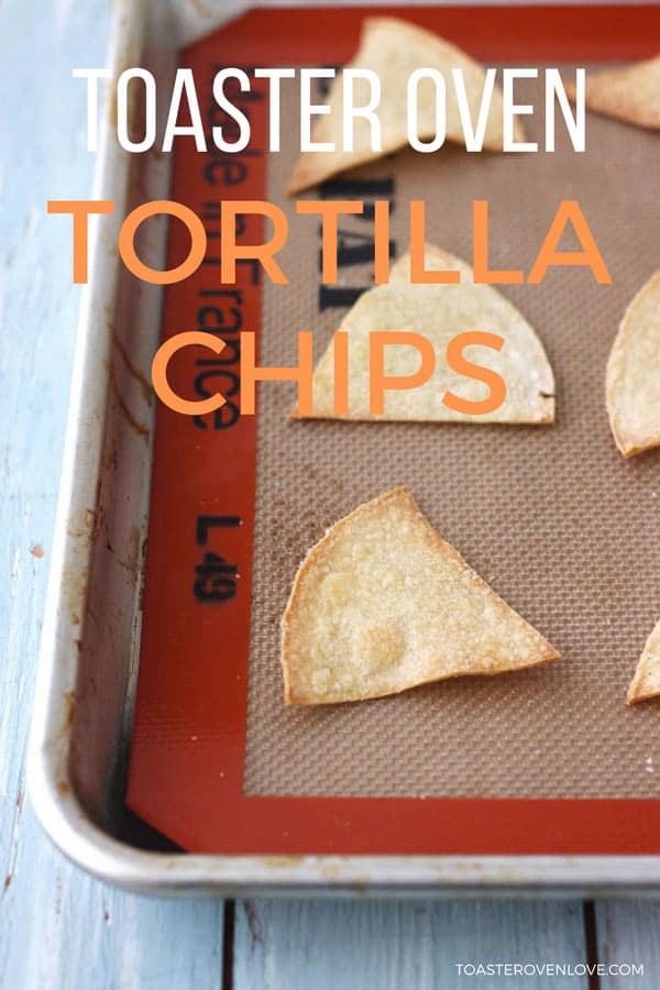 Baked tortilla chips on a silicone baking mat.