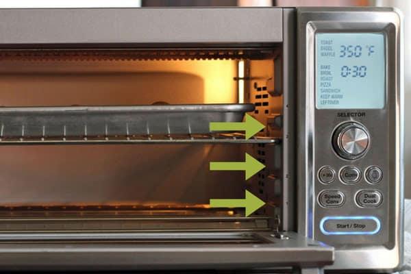 Cuisinart toaster oven with different rack placements pointed out.