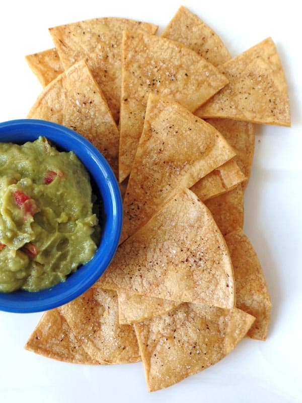 Baked corn tortilla chips with guacamole
