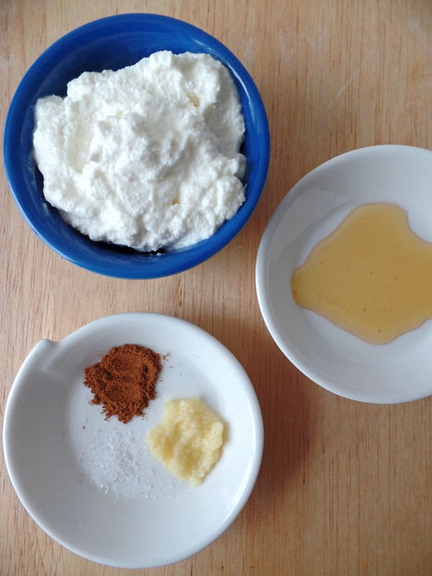 Small bowls of ricotta, honey, cinnamon, and ginger