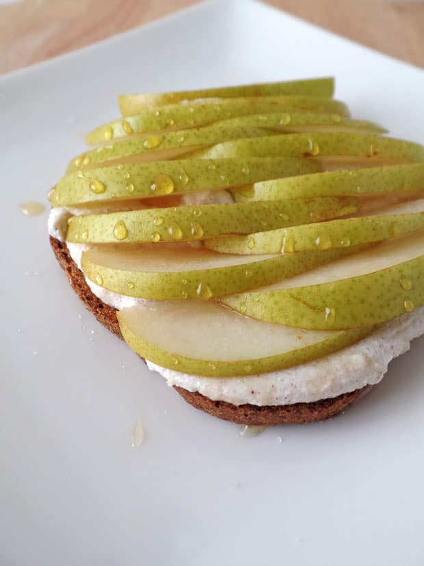 Closeup of pear slices drizzled with honey.