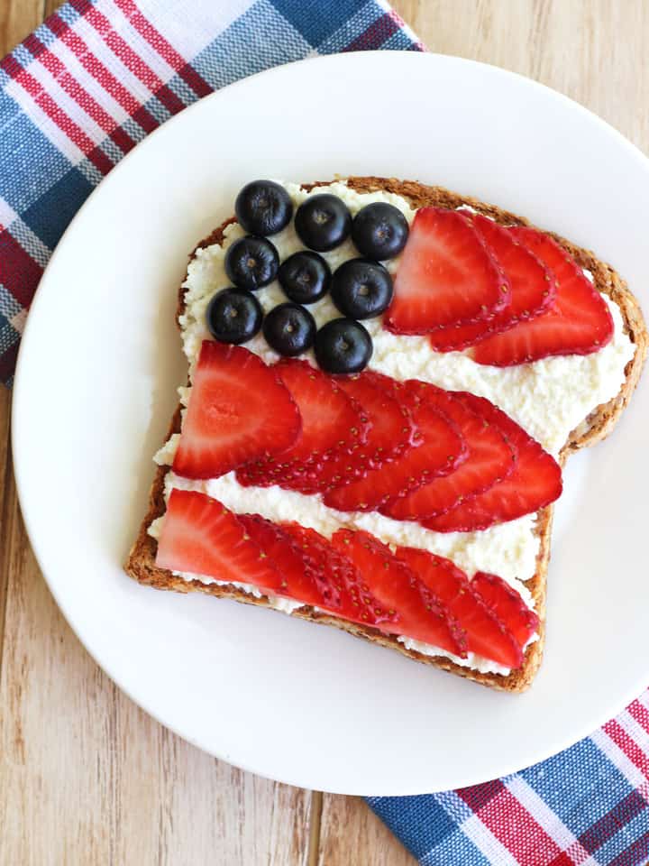 Overhead view of berry flag on a piece of toast.