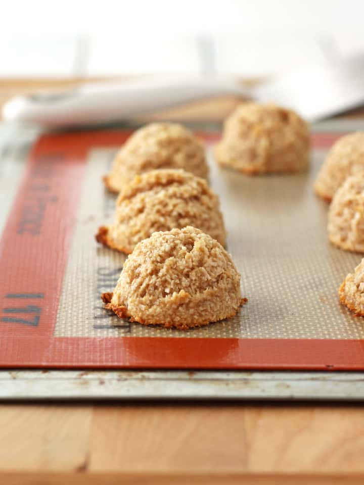 Cookies baked on a cookie sheet lined with a silicone mat.