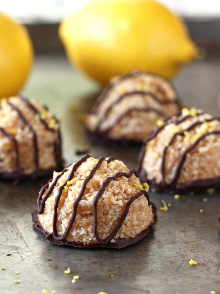 Sheet pan with cookies and fresh lemons.