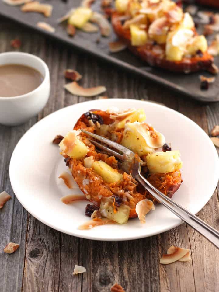 Fork scooping into a twice-baked sweet potato.