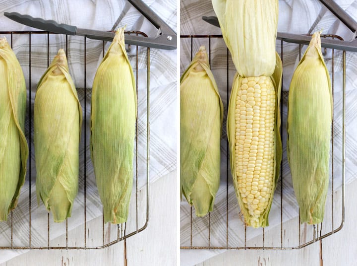 Baked corn on cooking rack and with husks pulled back.