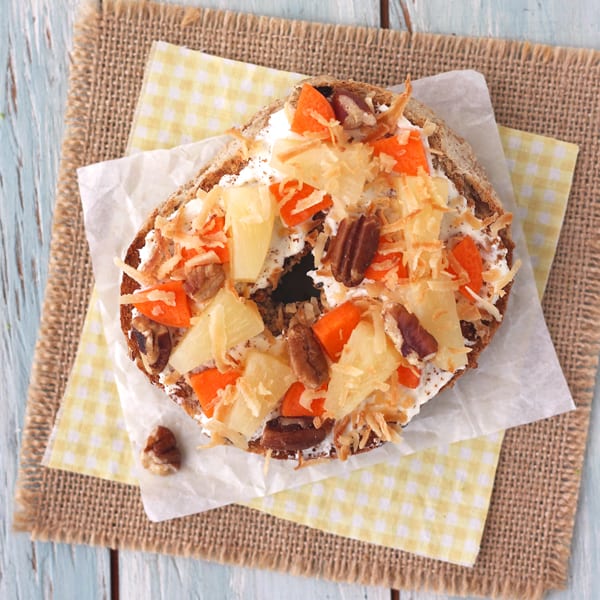 Toasted cinnamon raisin bagel with Greek yogurt cream cheese, carrots, toasted coconut and pecans.