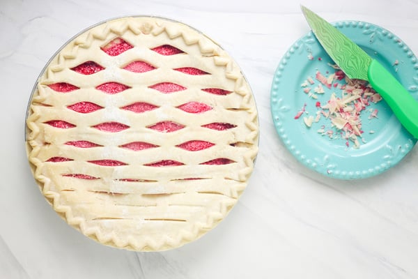 Frozen pie with plate of scraped off pie pieces.