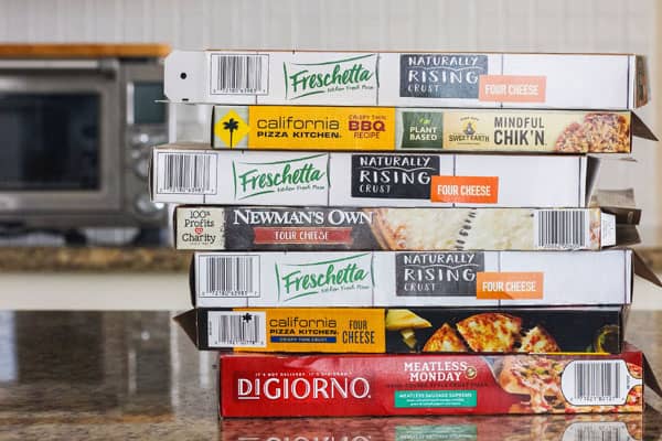 Stack of empty frozen pizza boxes