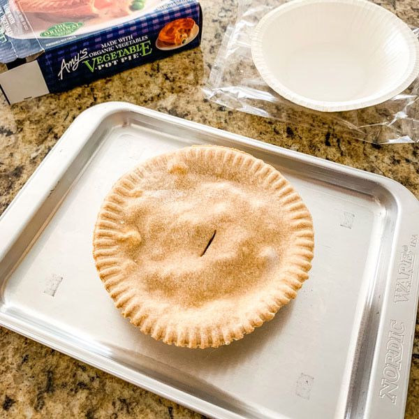 Frozen vegetable pot pie on a toaster oven baking sheet.