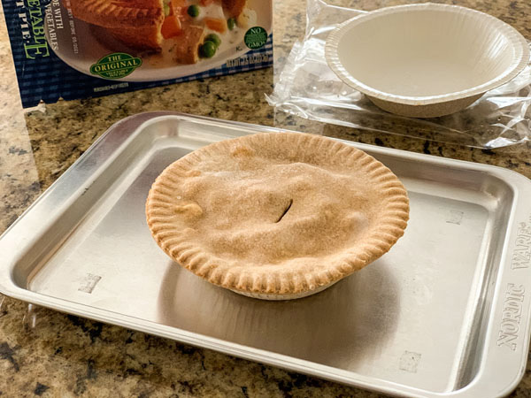Frozen vegetarian pot pie on a small baking sheet.