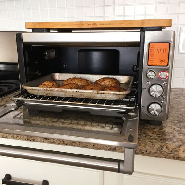 Potatoes on a quarter sheet pan inside a Breville Smart Oven Pro.