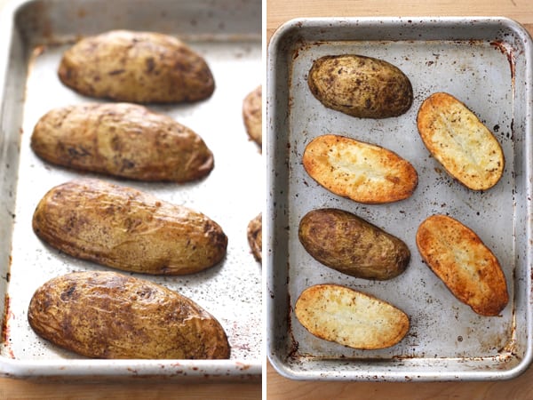 Browned and cooked baked potato halves on a baking sheet.
