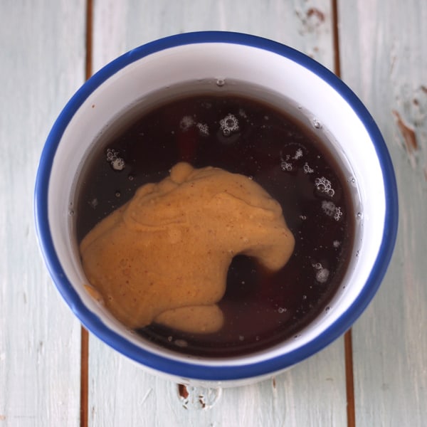 Peanut butter, honey and maple syrup in an oven-safe ramekin.