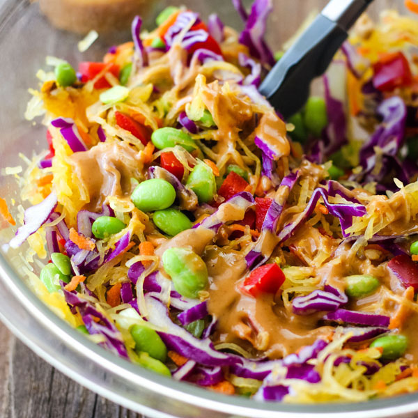 Spaghetti Squash Bowls ingredients in a bowl tossed with peanut sauce.