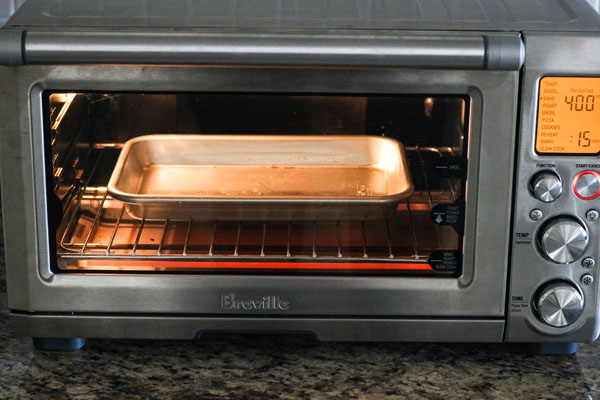 Small pan preheating inside a countertop oven.