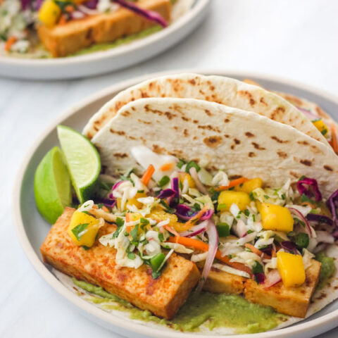Tofu Tacos with Mango Slaw on a blue plate.