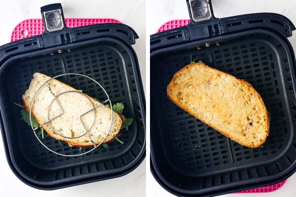 Air fryer basket with sandwich topped with trivet and a cooked grilled cheese.
