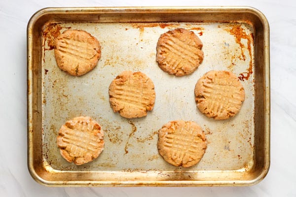 Baked cookies on a rimmed baking sheet.