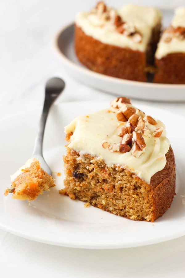 Slice of cake with a forkful taken out of it.