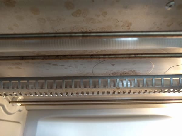 Stained toaster oven ceiling.