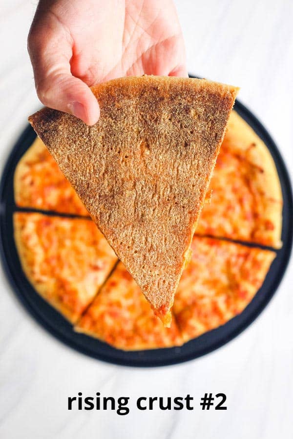 Close up of browned crust on pizza slice.