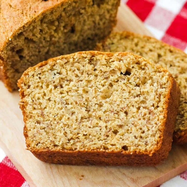 Closeup of banana bread slices on a cutting board.