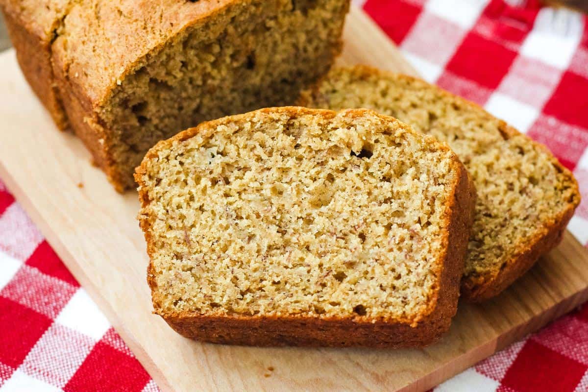 Closeup of banana bread slices on a cutting board.