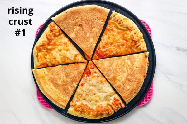 Overhead view of pizza slices on a pan.