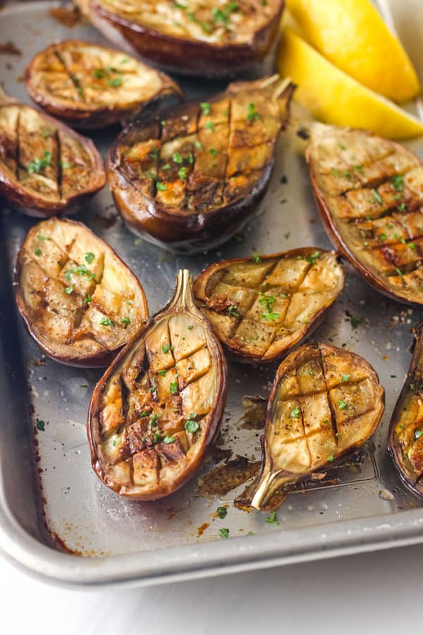Closeup of roasted eggplant with fresh parsley.