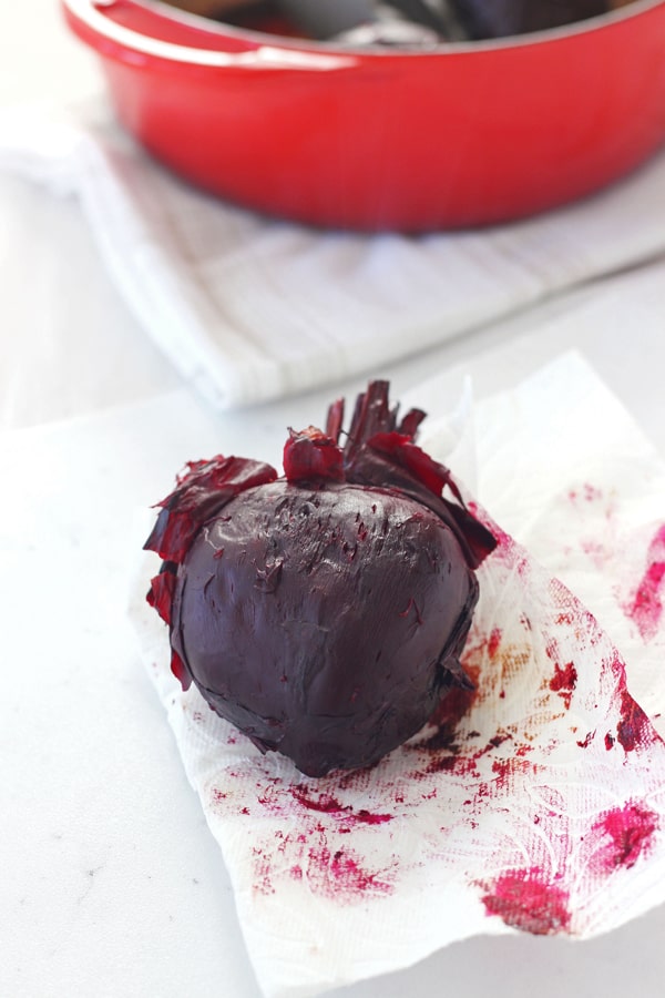 Roasted beet on a paper towel with it's skin rubbed off.