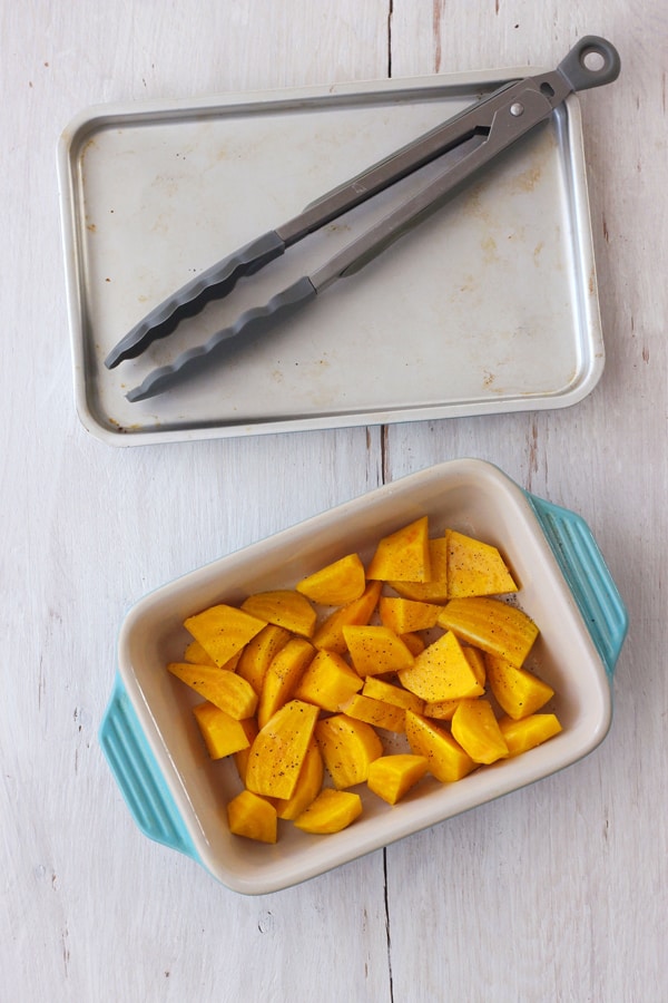 Chopped golden beets in a small baking dish.