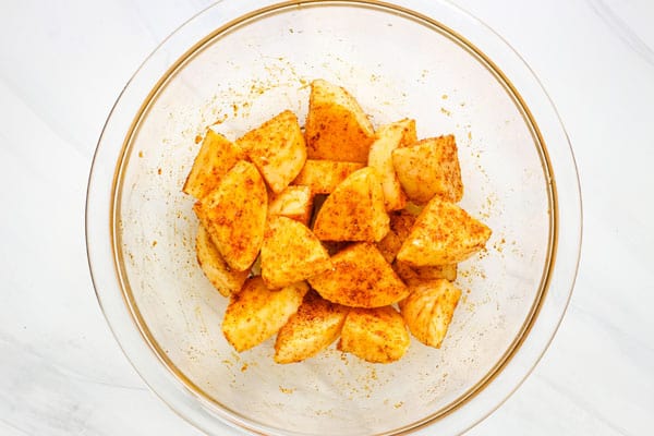 Class bowl with seasoned tube polenta pieces.