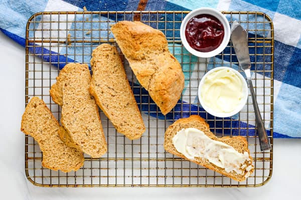 Sliced bread spread with butter.