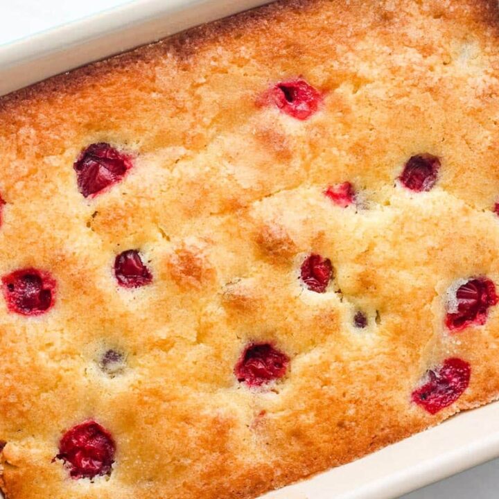 Overhead view of cranberry cake in a small baking dish.