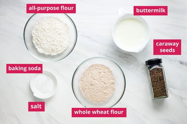 Soda bread ingredients arranged on a table and labeled.