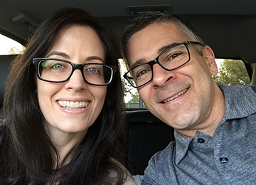 Man and woman smiling.