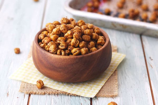 Toaster oven roasted chickpeas in a small wooden bowl.
