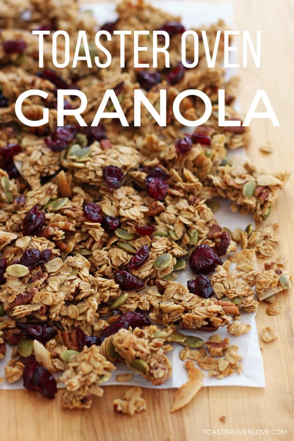 Large pile of granola clusters on a piece of parchment.