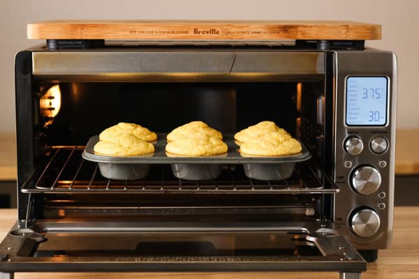 Pan of corn muffins inside a toaster oven.